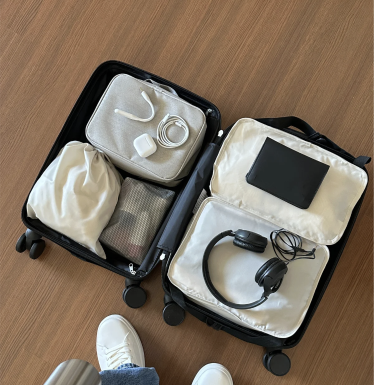 Suitcase on the floor with items packed inside
