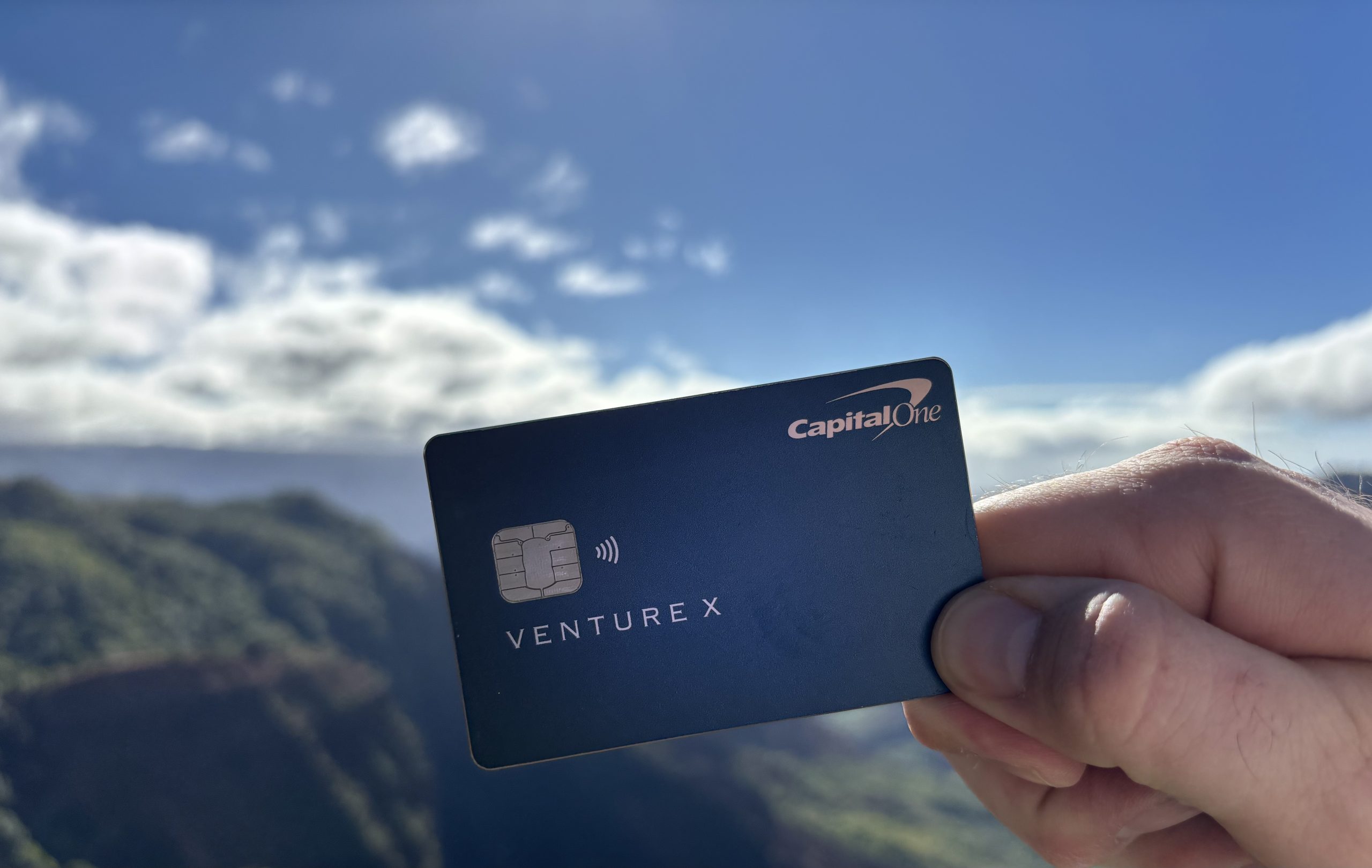 Picture of credit card with scenic view behind it