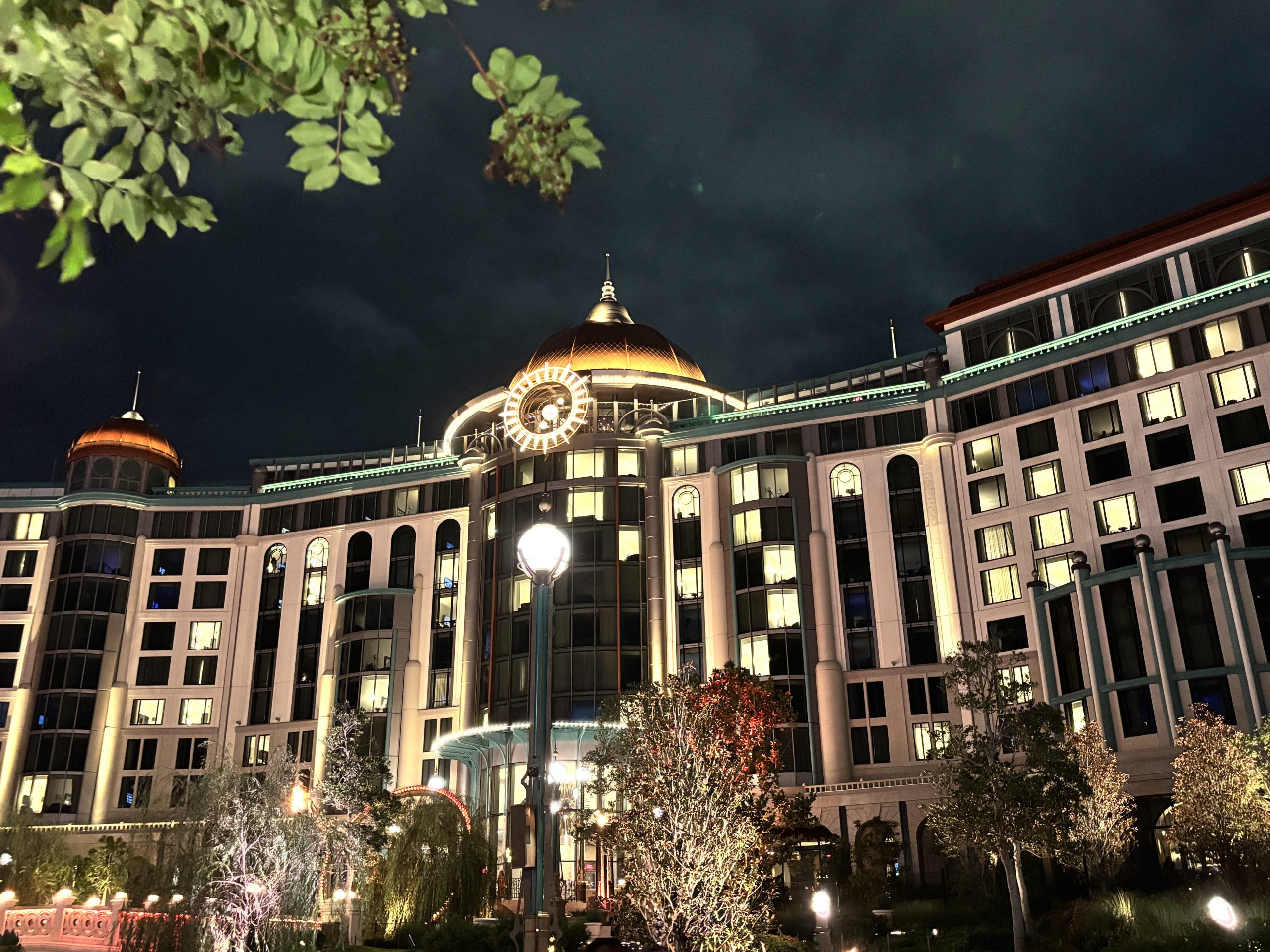 Nighttime view of Helios Hotel at Epic Universe