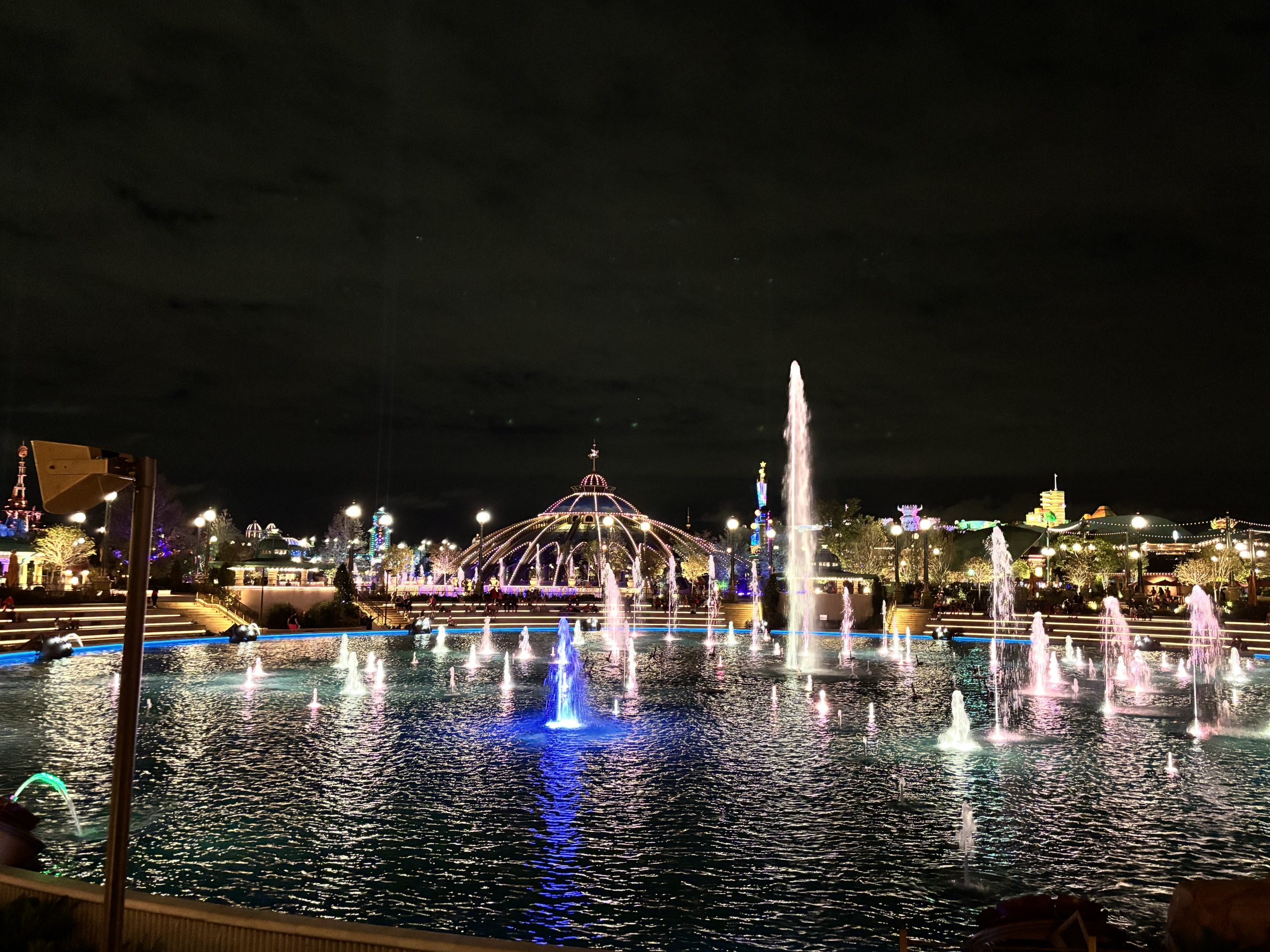View of pond in Celestial Park in Epic Universe at night